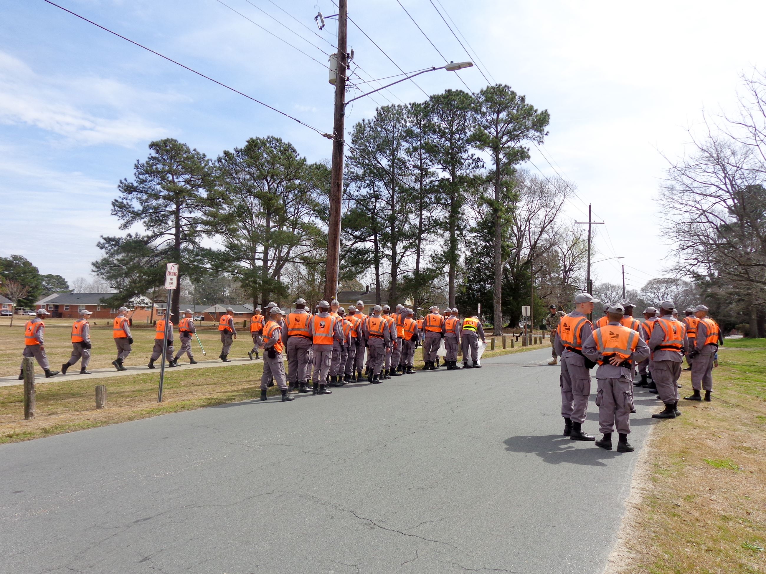 Clean Up Crew Standing on Road