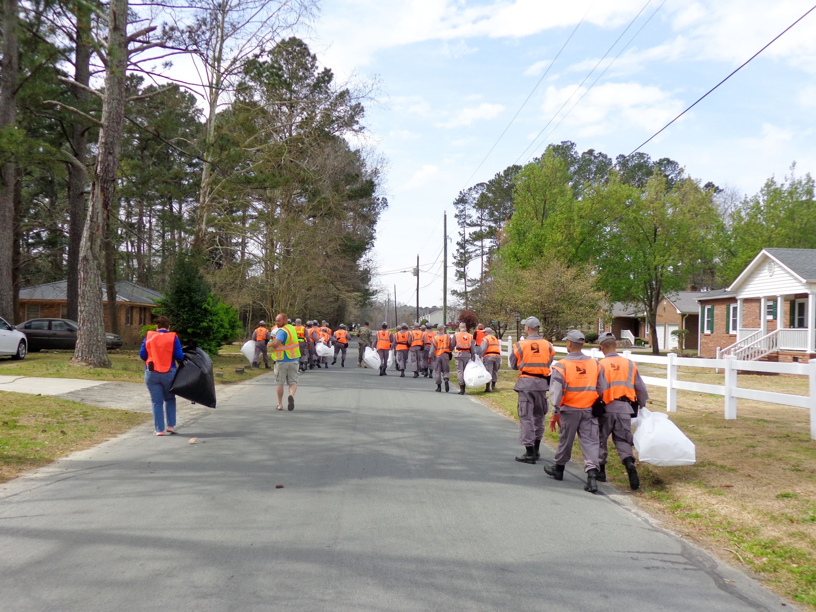 Clean Up Crew Walking on Road